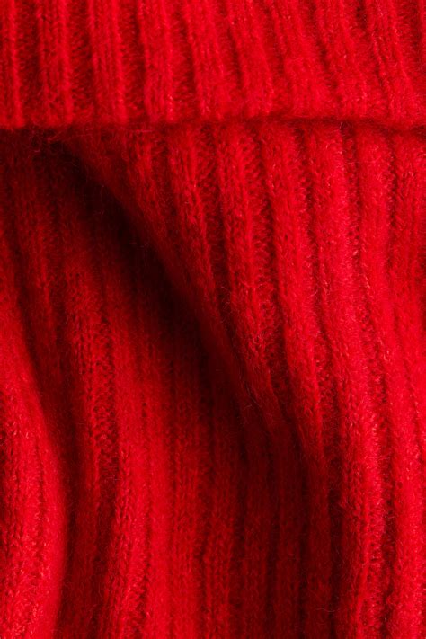 Primo piano del tessuto del berretto HERO che mostra la maglia acrilica e la fodera in pile