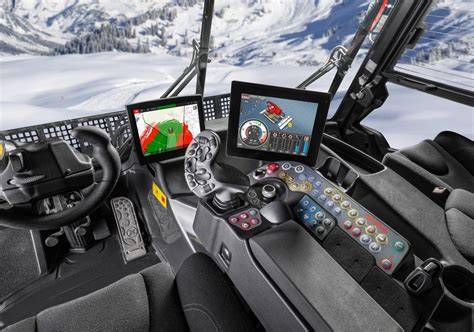 Vista interna della cabina del PistenBully 400 ParkPro, che mostra la disposizione ergonomica dei comandi e l'ampia visibilità