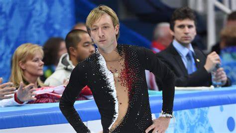Evgeni Plushenko durante una performance olimpica, mostrando la sua tecnica nei salti