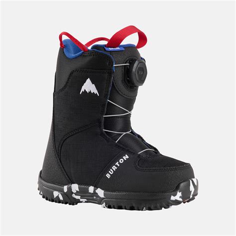 Bambino sorridente che indossa scarponi da snowboard Burton Grom Boa