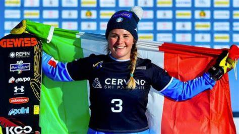 Collage di immagini che ritraggono Michela Moioli in azione durante gare di snowboard cross, con enfasi sulla sua grinta e determinazione.